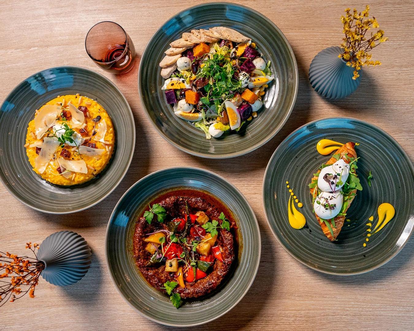 Doubletree By Hilton Fujairah City Exterior photo Dishes at the restaurant